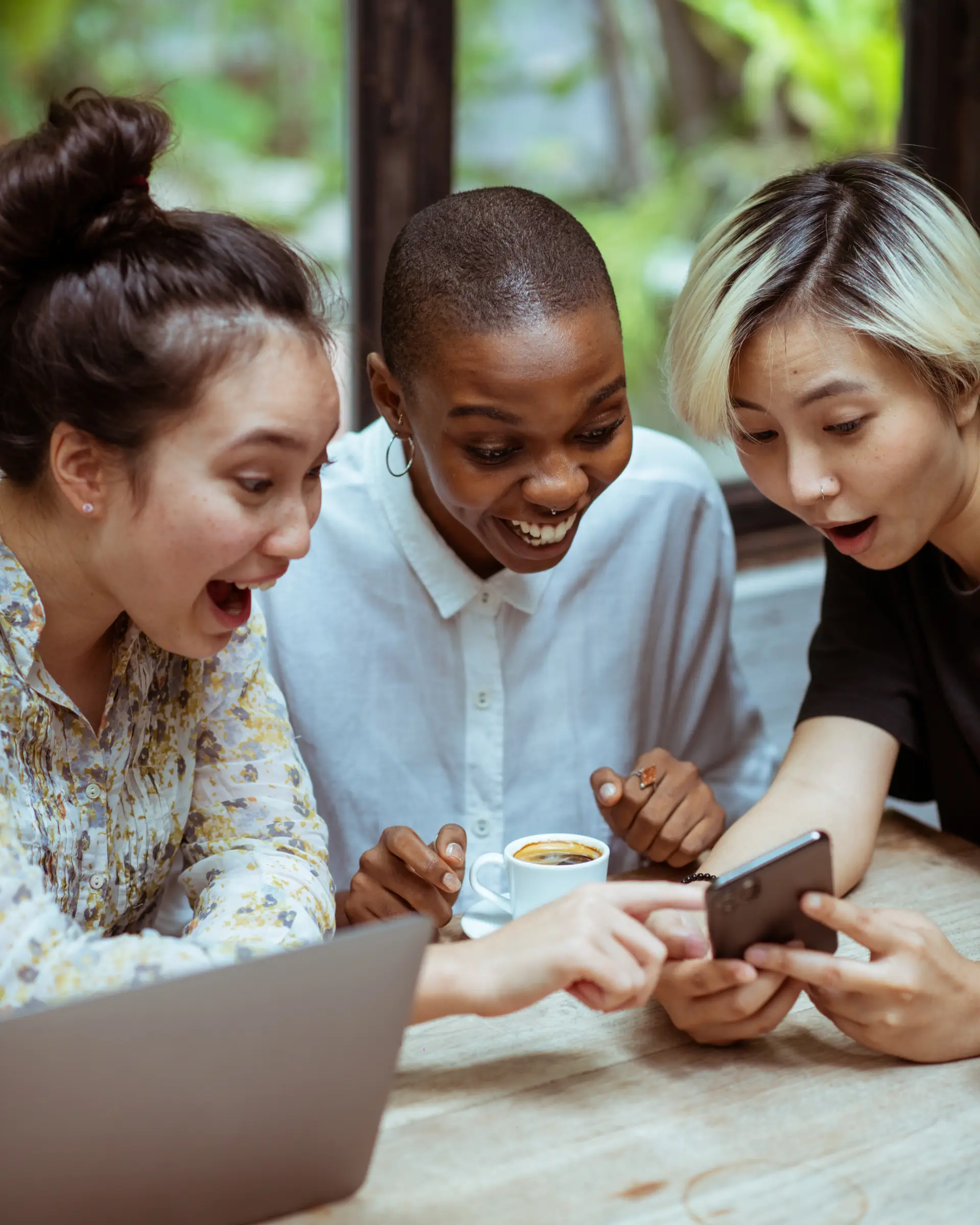 People talking and looking at mobile app
